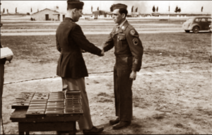 Lucera - T Sgt. A. Papin of Chatee MO receives Bronze Star from Brig. General C. W. Lawrence 04-1945